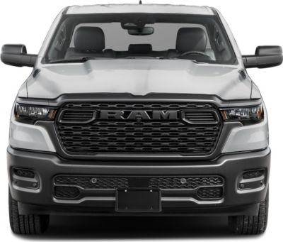 Front view of a pickup with bold grille and LED headlights.
