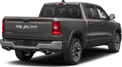 Rear side view of quad cab short pickup with dual exhaust and distinctive taillights