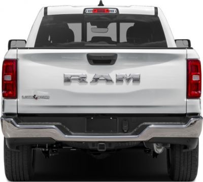 Rear rearview of a pickup with large emblem and chrome bumper