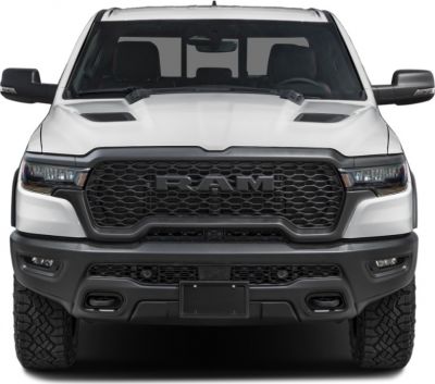 Front view of pickup with aggressive grille and hood vents