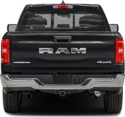 Rear view of pickup tailgate with RAM logo and 4x4 badge