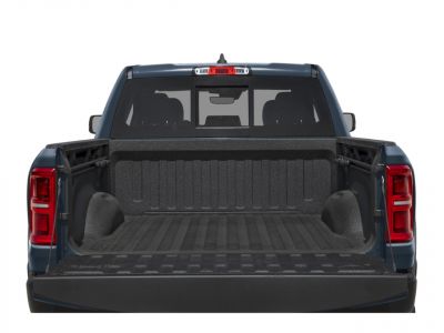 Pickup truck bed with textured liner and lowered tailgate