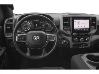 Steering wheel, gauge cluster, and touchscreen infotainment system