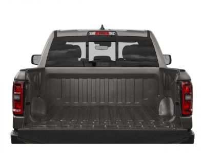 Open pickup truck bed with tailgate down and rear window view