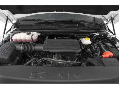 V6 3.6L engine bay with fluid reservoirs and battery terminal