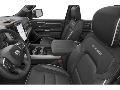 Premium truck interior with touchscreen, steering wheel, and branded seats