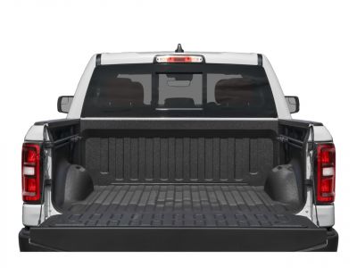 Open tailgate with protective bed liner and rear window of pickup truck