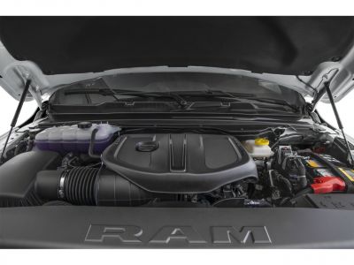 Engine bay with modern engine cover and visible components