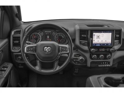 Steering wheel and modern dashboard with digital display and touchscreen infotainment
