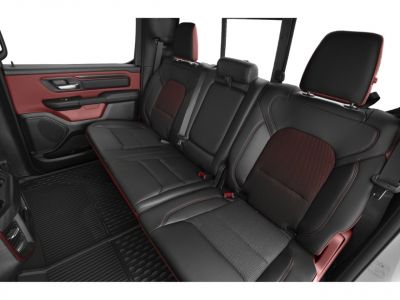 Black and red leather rear seating with seat belts and rubber floor mats