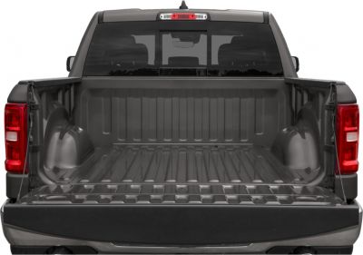 Open truck bed with tailgate and rear lighting.