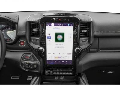Touchscreen infotainment system and dashboard controls with modern interface.