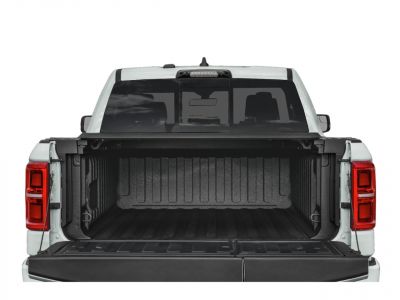 Open truck bed with drop tailgate and protective liner