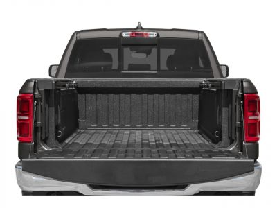 Open truck bed with textured liner and red tail lights