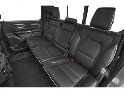 Rear seat interior with black leather upholstery and ergonomic design