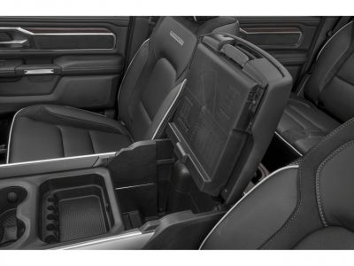 Center console storage compartment and black luxury seating upholstery