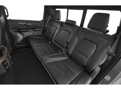Black leather rear seats with detailed stitching and spacious layout