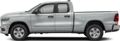 Side profile of a silver quad cab short pickup truck