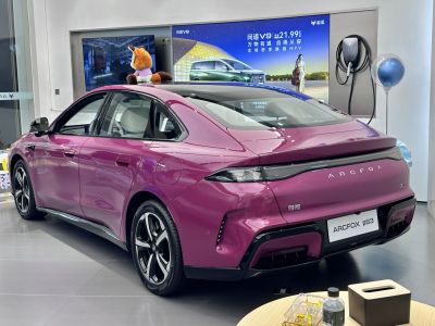 Rear view of electric sedan with integrated LED taillights and aerodynamic rear design