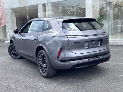 Rear view of a modern SUV with sleek taillights and distinctive alloy wheels