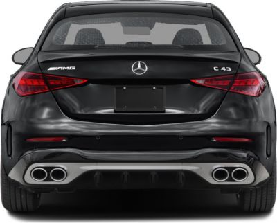 Rear view of sleek sporty sedan with AMG badge and quad exhausts