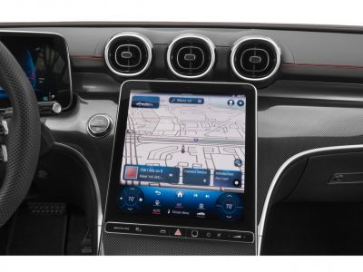 Large touchscreen display, circular air vents, modern dashboard design.