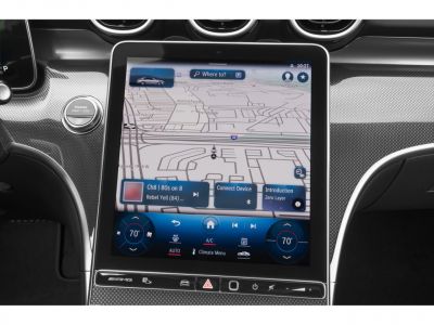Large touchscreen infotainment system with navigation and climate control.