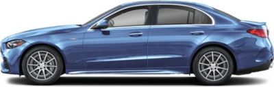 Side profile of blue sedan with alloy wheels and sleek aerodynamic design.