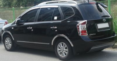 Rear and side profile with chrome trim and roof rails