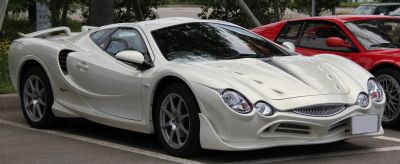 Ventilated hood and curvaceous aerodynamic body with dual round headlights