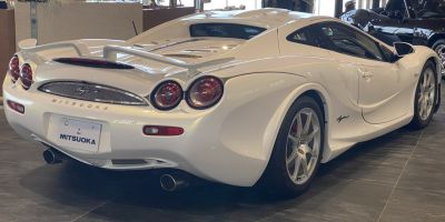 Distinctive rear view with quad round taillights and dual exhaust pipes