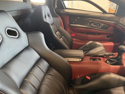 Leather sport seats and red-black interior paneling