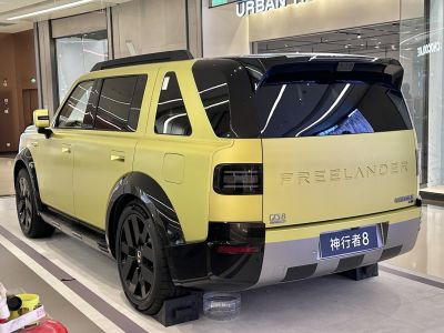 Rear view of a large two-tone SUV with modern styling and blacked-out rear window.