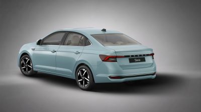 Rear view of a modern sedan with LED tail lights and alloy wheels.