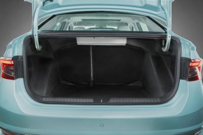 Open spacious trunk cargo area with clear interior and taillights