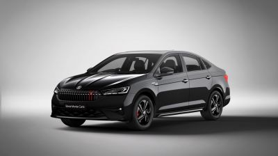 Sporty front grille and aerodynamic side profile of a black sedan