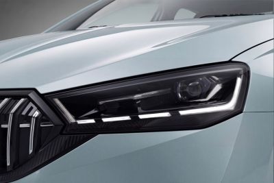 Close-up of stylish headlight and front grille design with LED elements