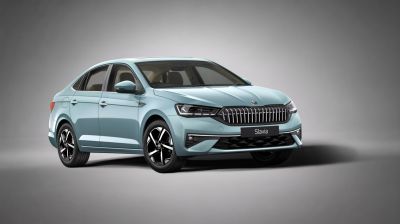 Modern sedan front with vertical grille and angular LED headlights