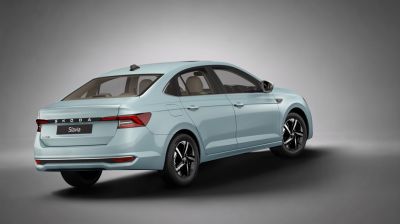 Rear side view of sedan with modern tail lights and alloy wheels