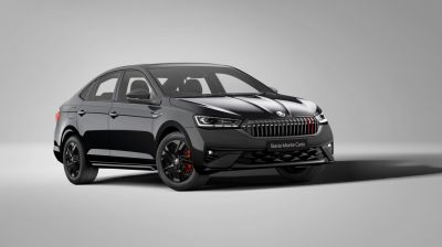 Black sedan with modern grille and alloy wheels