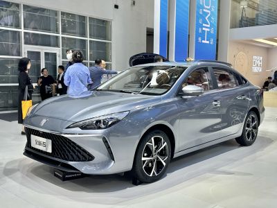 Silver mid-size sedan with sharp headlights and sporty alloy wheels