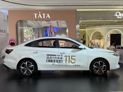 Modern side profile of a mid-size sedan with alloy wheels