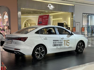White sedan with sharp taillights and sporty alloy wheels.