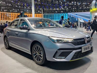 Silver sedan with LED headlights and modern grille front side view