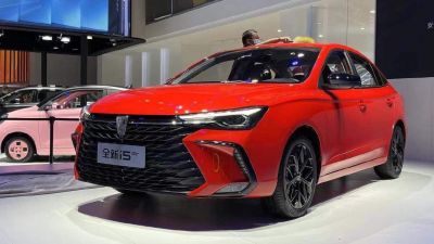 Front view of red sedan with black grille and LED headlights