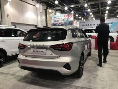 Rear view of electric hatchback with sleek LED tail lights and aerodynamic design