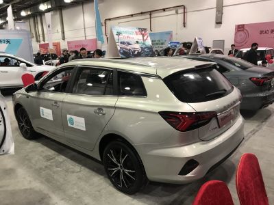 Electric station wagon with black alloy wheels and distinctive LED tail lights