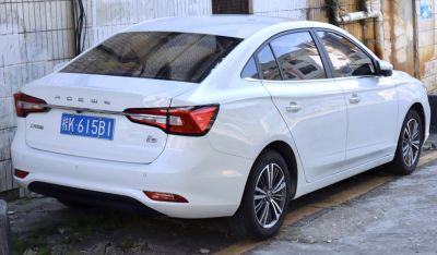 Rear and side view with distinctive taillights and sleek body design