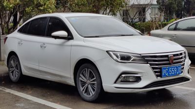 Front side view with LED headlights and prominent grille