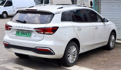 Rear view with split tail lights, roof rails, and windshield wiper